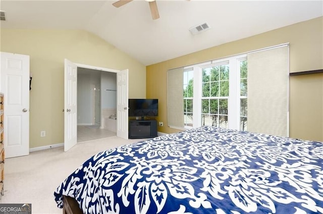 bedroom featuring light carpet, baseboards, visible vents, and vaulted ceiling