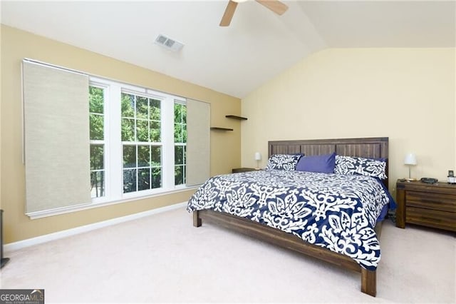 bedroom featuring carpet floors, lofted ceiling, visible vents, a ceiling fan, and baseboards