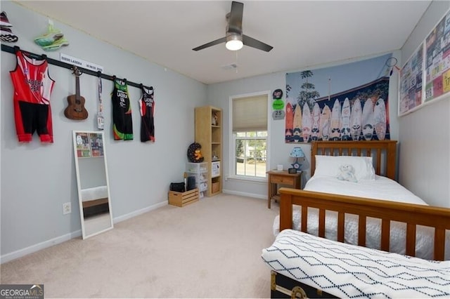 bedroom featuring carpet floors, baseboards, and a ceiling fan