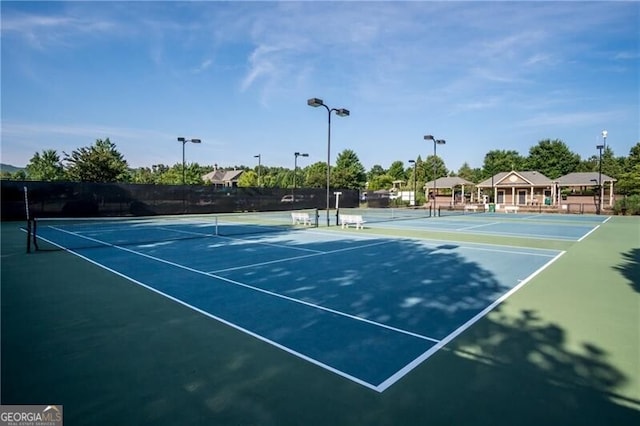 view of sport court with fence