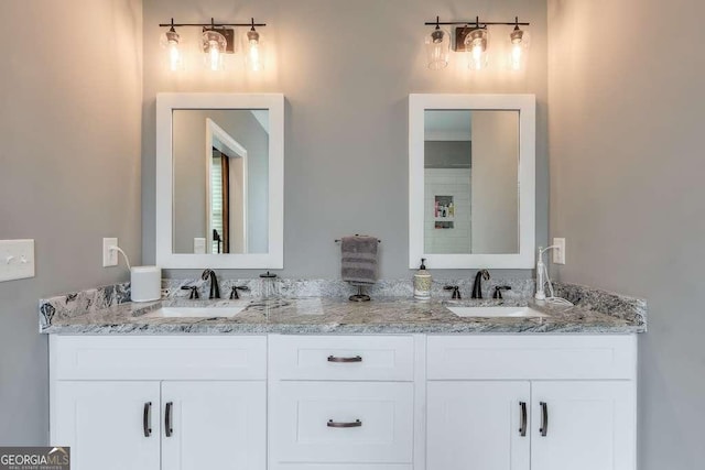 bathroom featuring double vanity and a sink