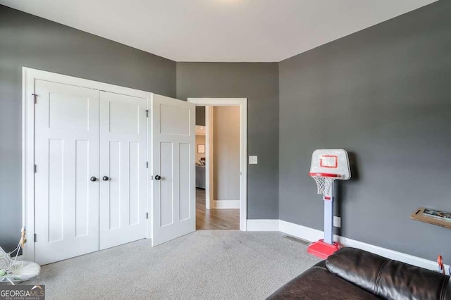 carpeted bedroom with baseboards