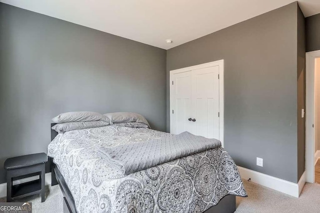 bedroom featuring carpet floors and baseboards