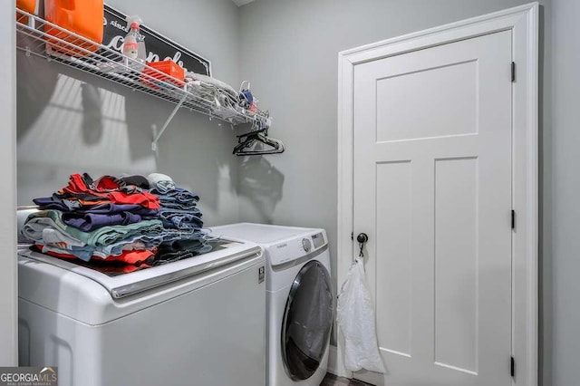 laundry room featuring laundry area and washing machine and dryer