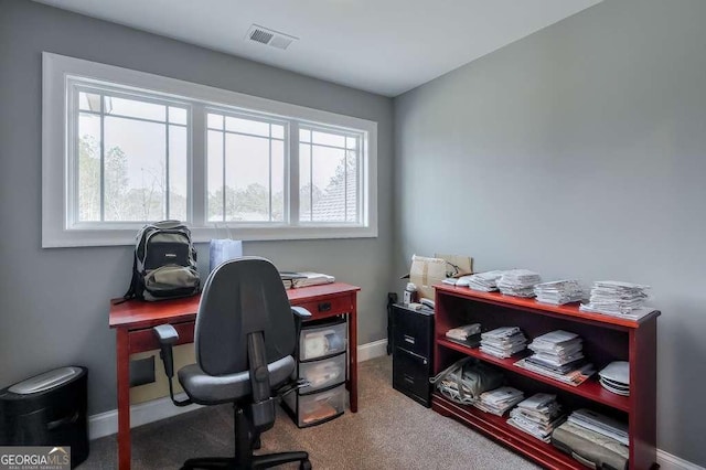 home office featuring carpet floors, baseboards, and visible vents