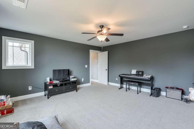 miscellaneous room featuring carpet flooring, ceiling fan, and baseboards