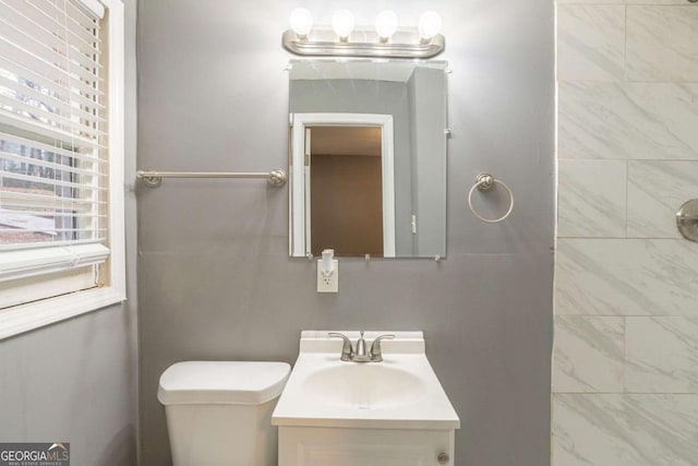 bathroom with vanity and toilet