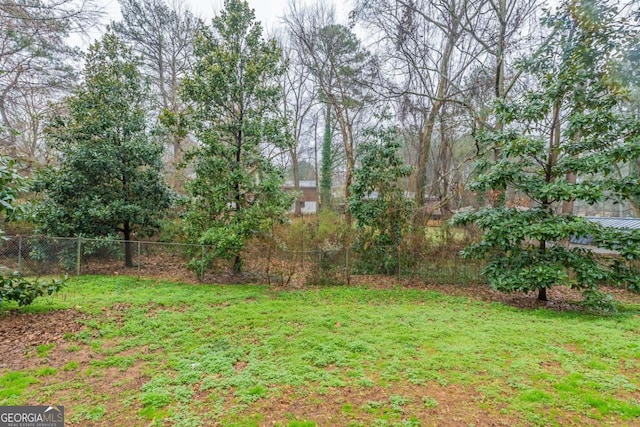 view of yard with fence