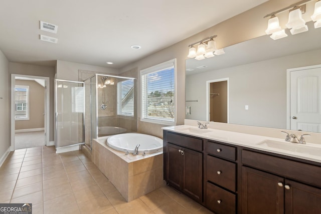 full bath with plenty of natural light, visible vents, and a sink