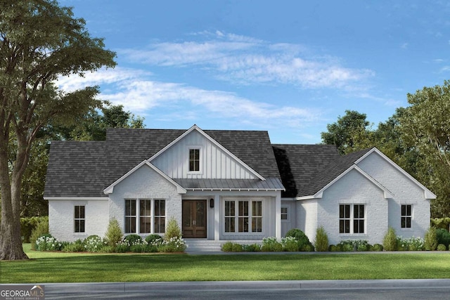 modern farmhouse with roof with shingles, brick siding, board and batten siding, and a front yard