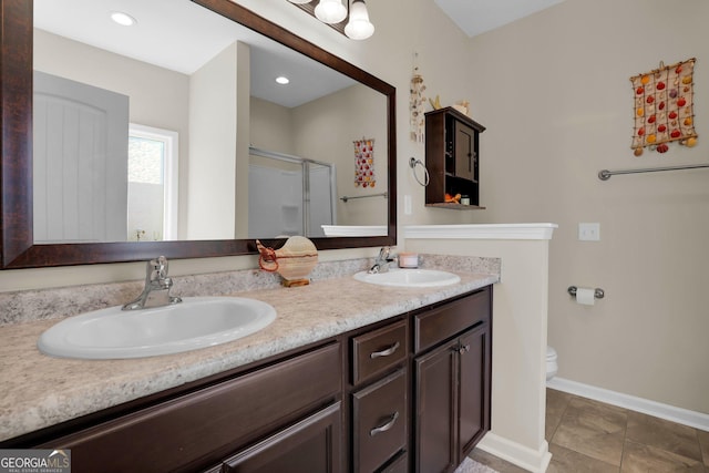 152 Summerhill Dr NE, Ludowici, GA 31316 - full bathroom with toilet, a shower stall, double vanity, and a sink