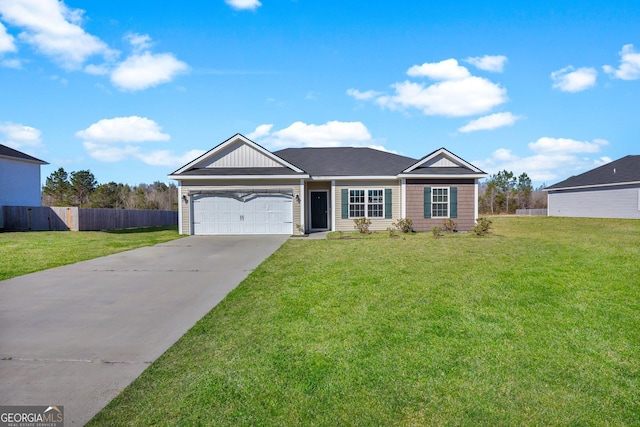 ranch-style home featuring a garage, driveway, fence, and a front yard