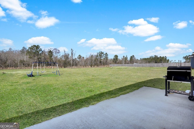 152 Summerhill Dr NE, Ludowici, GA 31316 - view of yard with fence and a patio