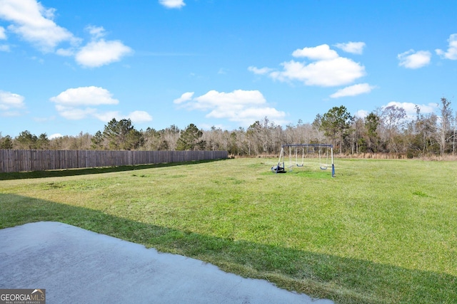 152 Summerhill Dr NE, Ludowici, GA 31316 - view of yard with fence