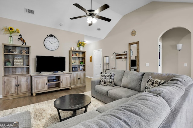 152 Summerhill Dr NE, Ludowici, GA 31316 - living room with dark wood-style floors, ceiling fan, visible vents, and arched walkways