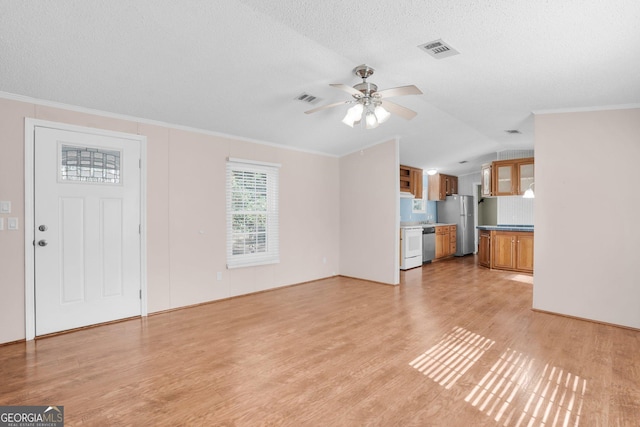 unfurnished living room with ornamental molding, visible vents, and light wood-style flooring
