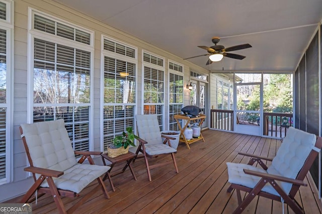 sunroom / solarium with ceiling fan