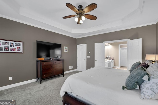 bedroom with baseboards, a raised ceiling, carpet flooring, and ornamental molding