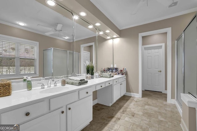 full bathroom with a stall shower, baseboards, a ceiling fan, ornamental molding, and vanity