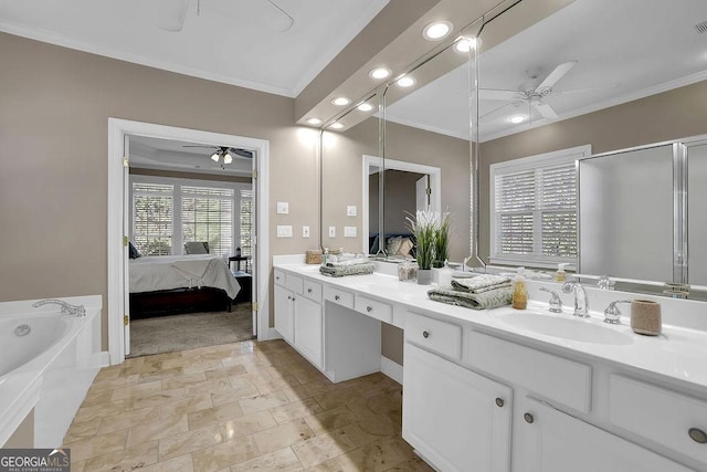 bathroom with ensuite bath, ceiling fan, crown molding, and a sink