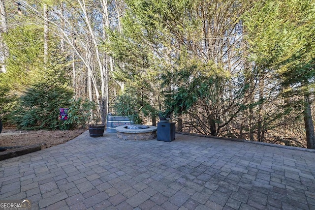 view of patio with an outdoor fire pit