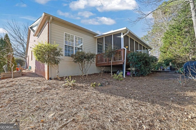 exterior space with a sunroom