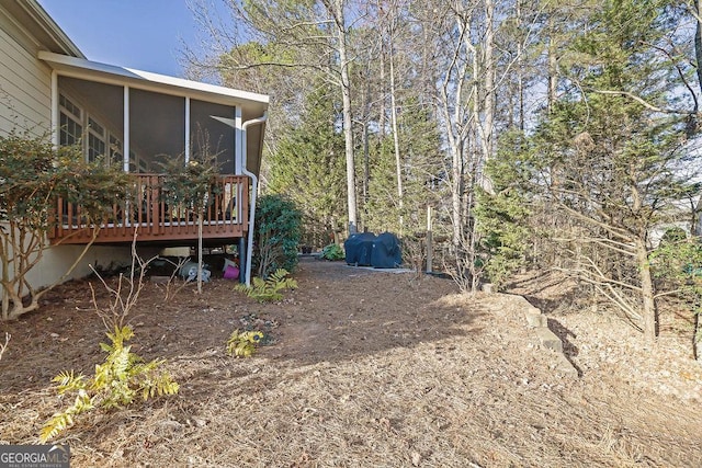 view of yard featuring a sunroom