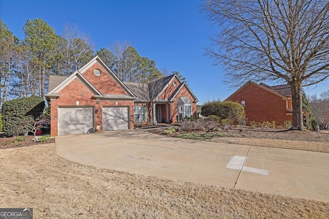 view of front of property featuring driveway, an attached garage, and brick siding