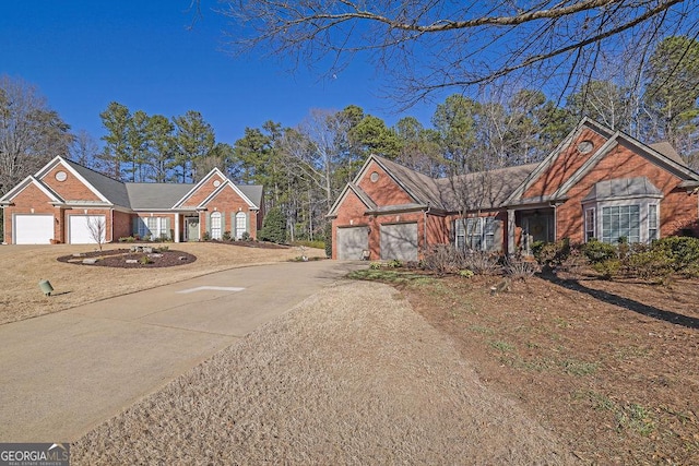 view of front of home with brick siding, driveway, and an attached garage