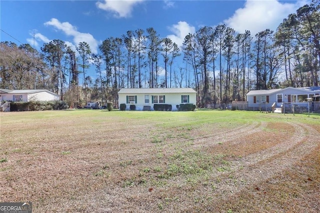 ranch-style home with a front yard