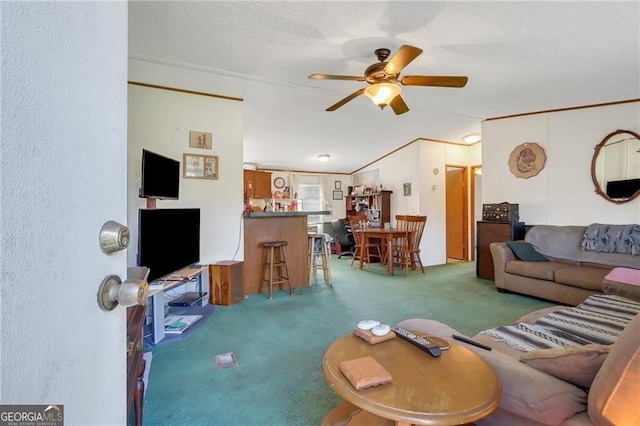 living room featuring carpet, a dry bar, vaulted ceiling, a textured ceiling, and ceiling fan