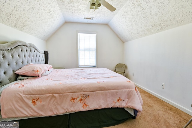 bedroom with carpet floors, lofted ceiling, visible vents, a textured ceiling, and baseboards