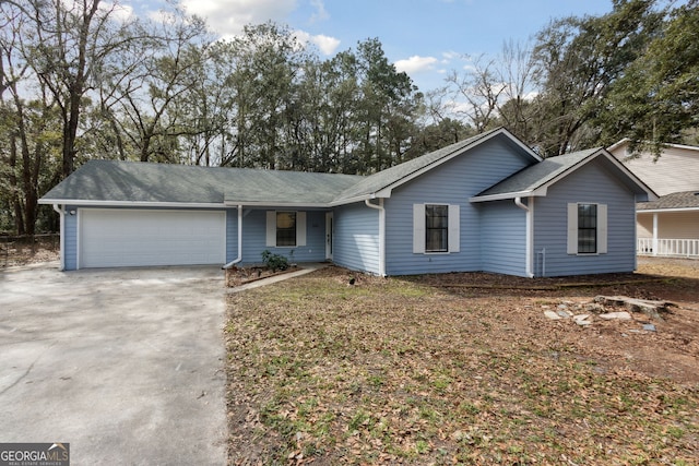 single story home with an attached garage and concrete driveway