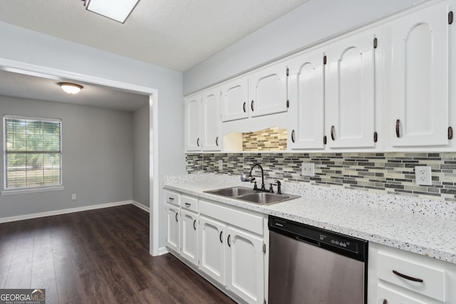 kitchen featuring baseboards, white cabinets, dishwasher, dark wood-type flooring, and a sink