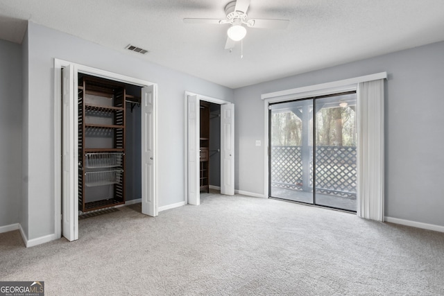 unfurnished bedroom featuring light carpet, baseboards, visible vents, and access to exterior