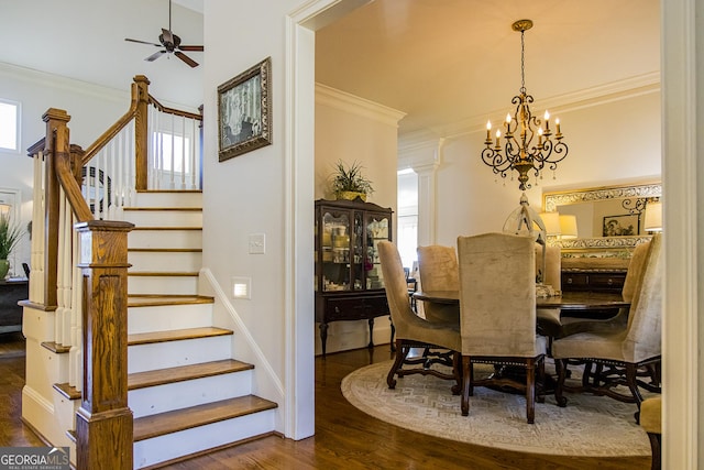 dining area featuring stairs, wood finished floors, and crown molding