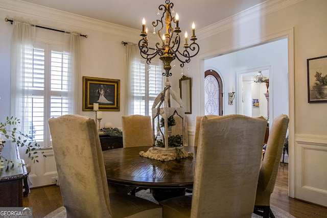 dining area featuring ornamental molding, a healthy amount of sunlight, and dark wood finished floors