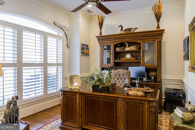 home office with visible vents, wood finished floors, a wealth of natural light, and wainscoting