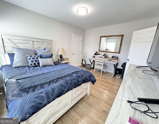 bedroom with wood finished floors