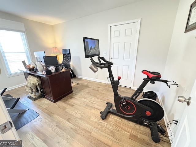 office featuring light wood-style flooring and baseboards