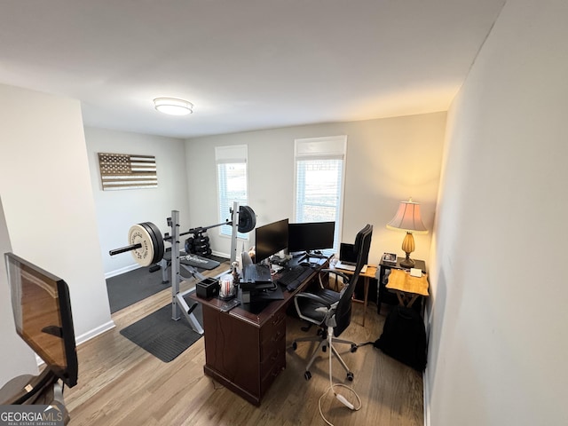 office featuring wood finished floors and baseboards