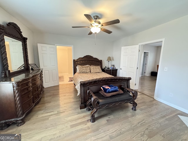 bedroom featuring a ceiling fan, baseboards, and wood finished floors