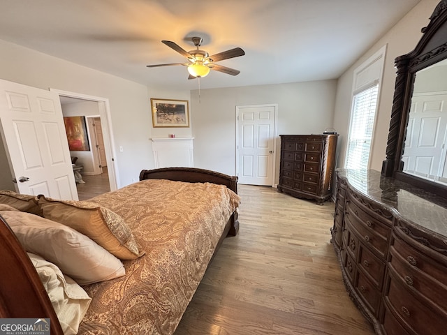 bedroom featuring light wood finished floors and ceiling fan