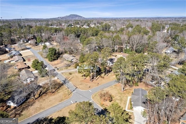 birds eye view of property featuring a mountain view