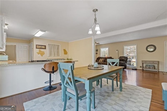 dining area featuring light wood-style flooring