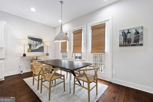 dining room with dark wood-style floors, baseboards, and recessed lighting