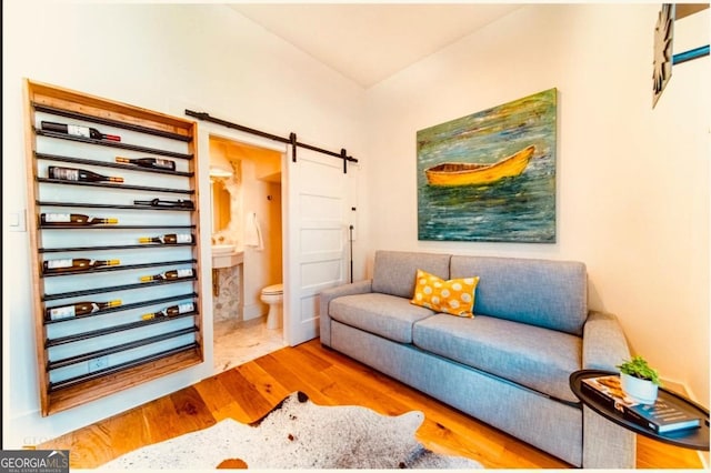 155 Mado Ln, Palmetto, GA 30268 - living room featuring light wood-style flooring and a barn door