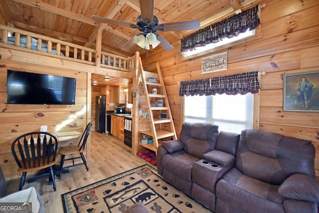 living area featuring wood walls, wood ceiling, and light wood-style floors