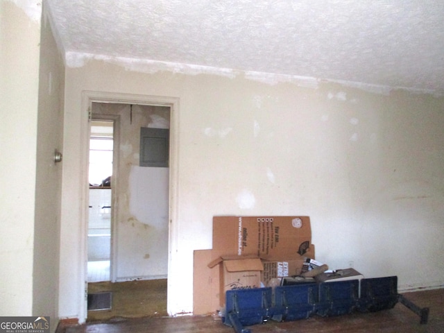 empty room with visible vents and a textured ceiling