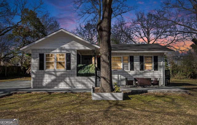 view of front of home with a lawn